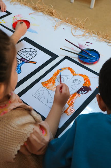 Children painting colorful and abstract art projects in a school setting. Focus on creativity and education.